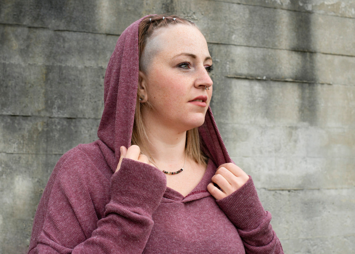 PLUS SIZE, long, plain knitted sweater with a large hood and thumbholes in red