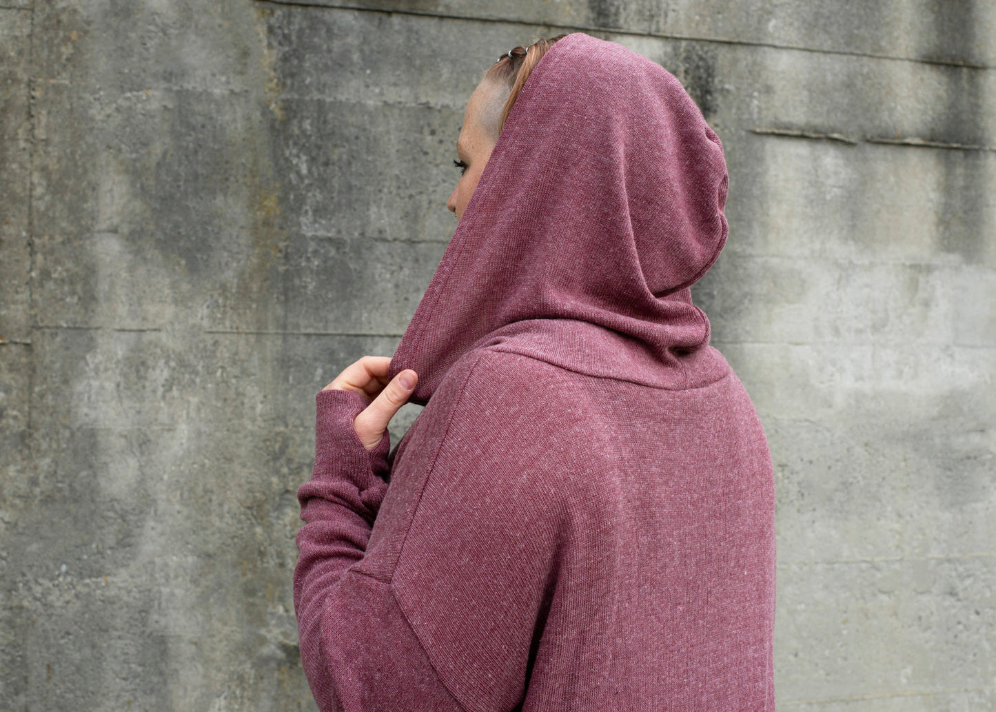 PLUS SIZE, long, plain knitted sweater with a large hood and thumbholes in red