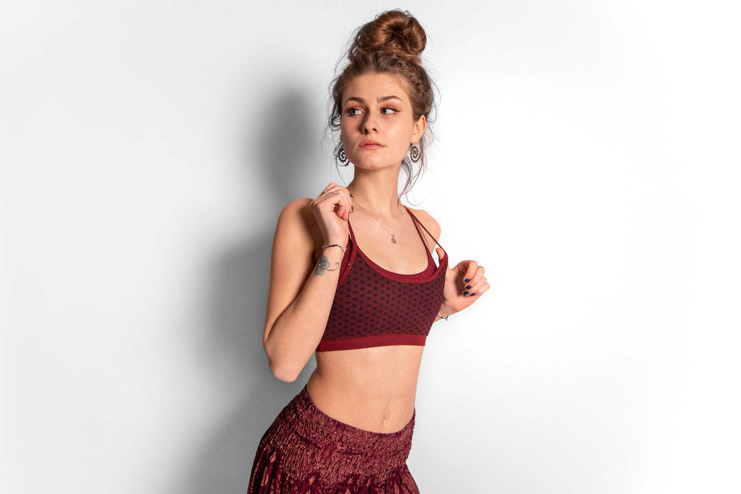 Yoga top with the pattern of the flower of life red