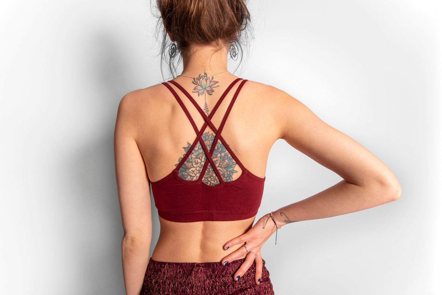 Yoga top with the pattern of the flower of life red