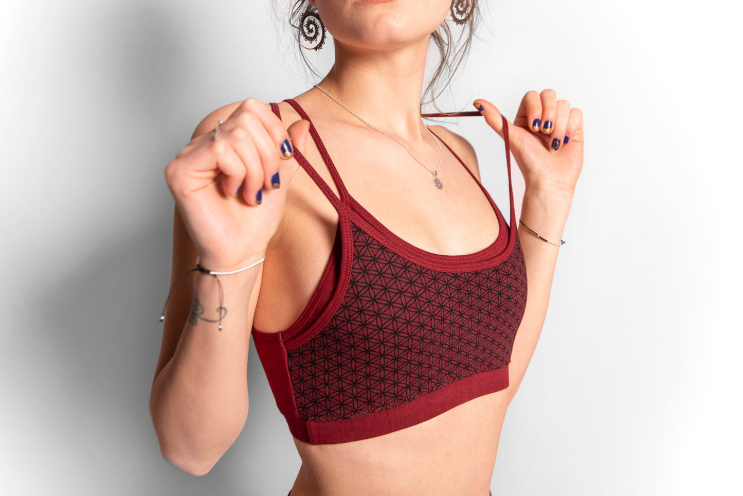 Yoga top with the pattern of the flower of life red