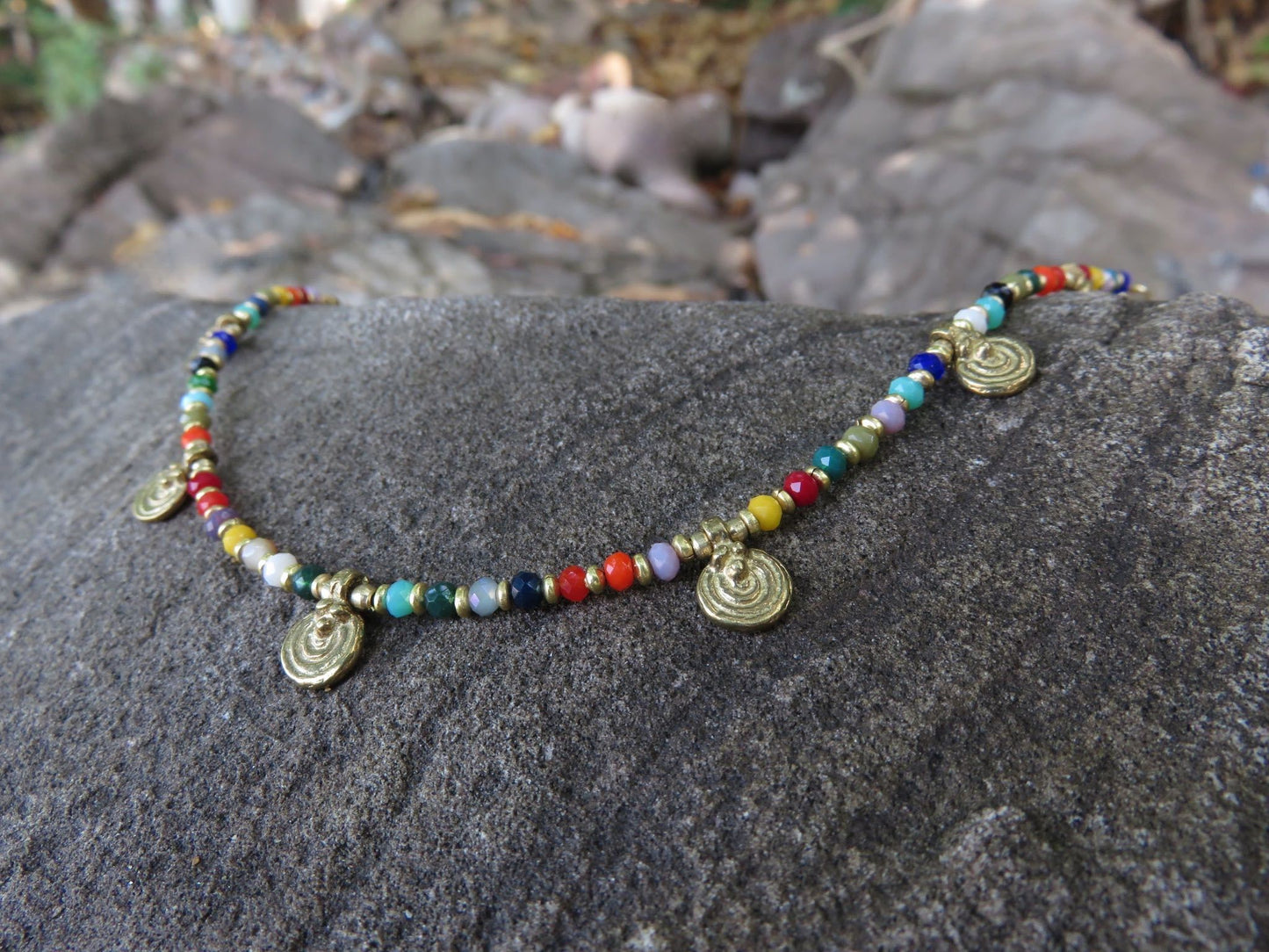 colorful anklet with small spirals made of brass
