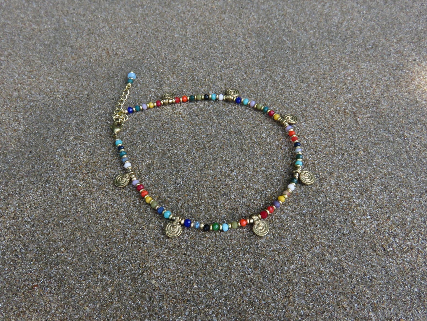 colorful anklet with small spirals made of brass