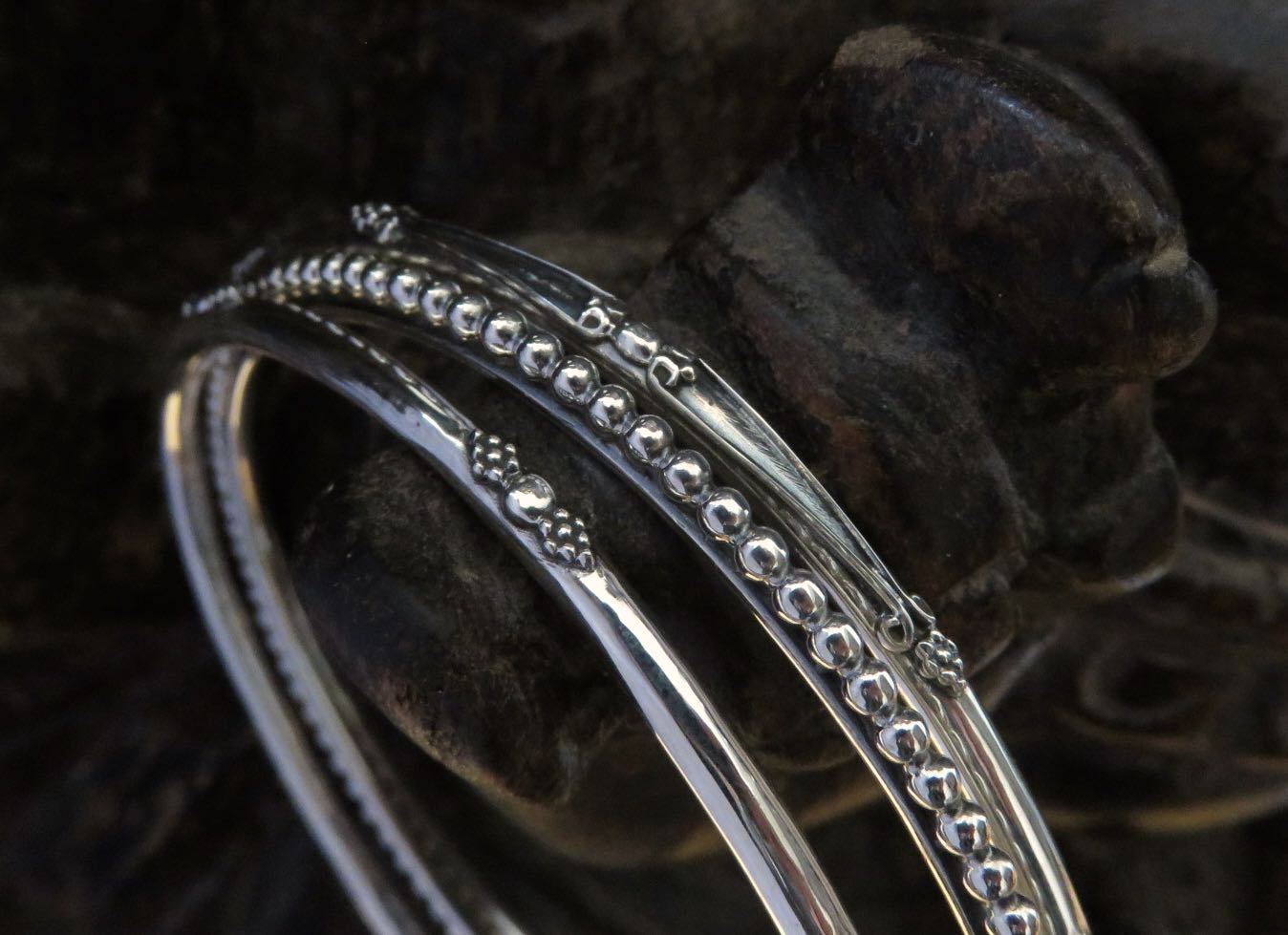 Set of three decorated silver bangles