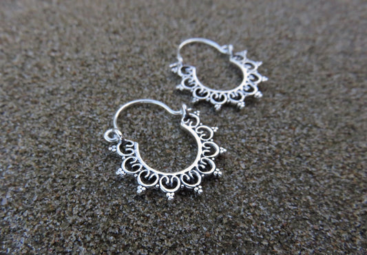 small hoop earrings with a filigree pattern made of silver