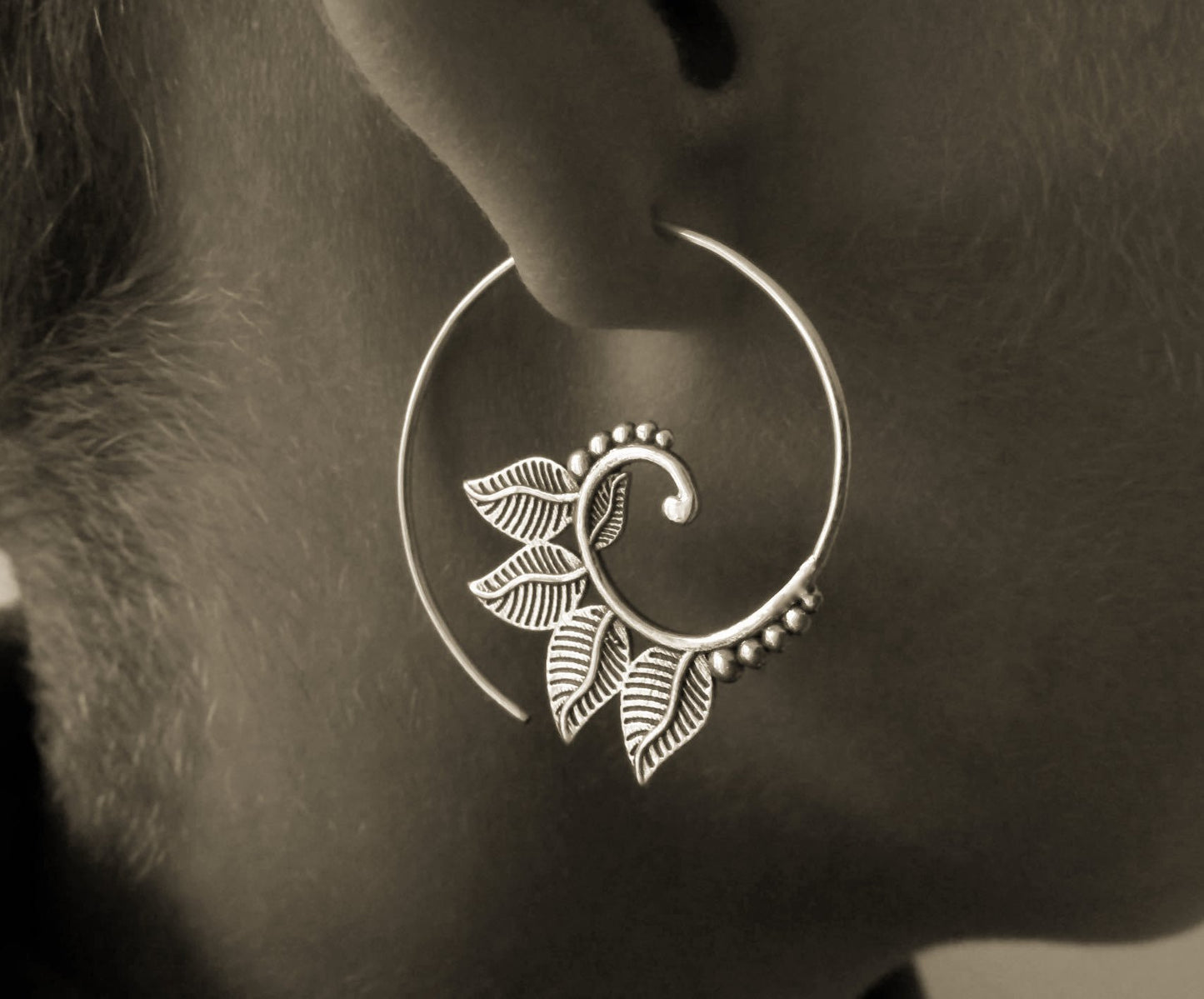 playful spiral earrings with brass leaves