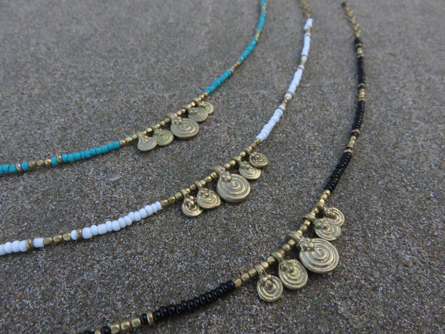 Anklet with small spiral pendants made of brass