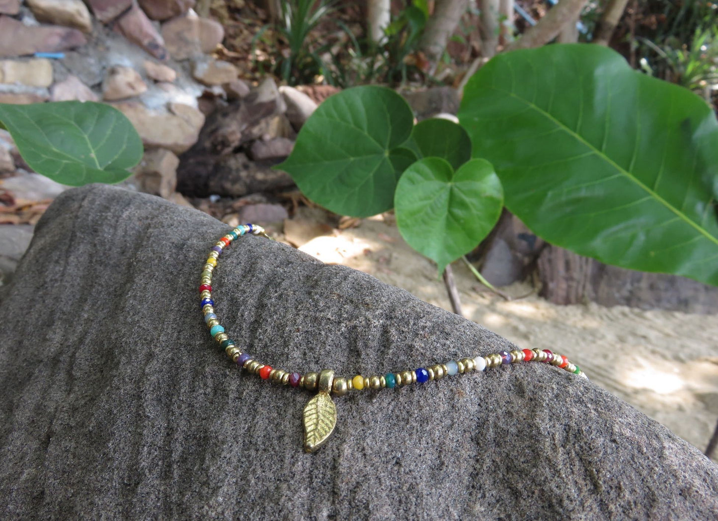 colorful anklet with a small leaf made of brass
