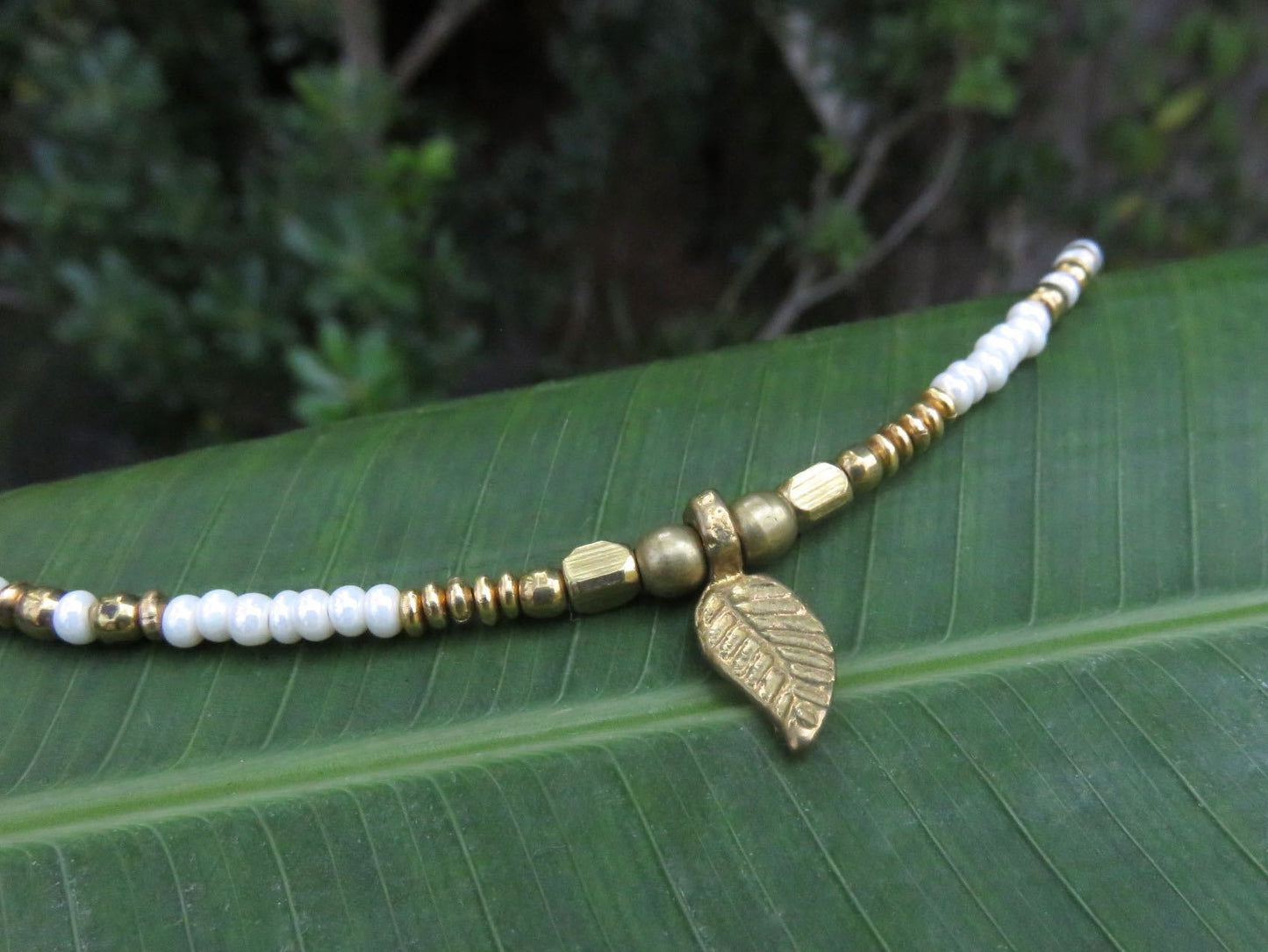 Anklet with small brass leaf and colored beads