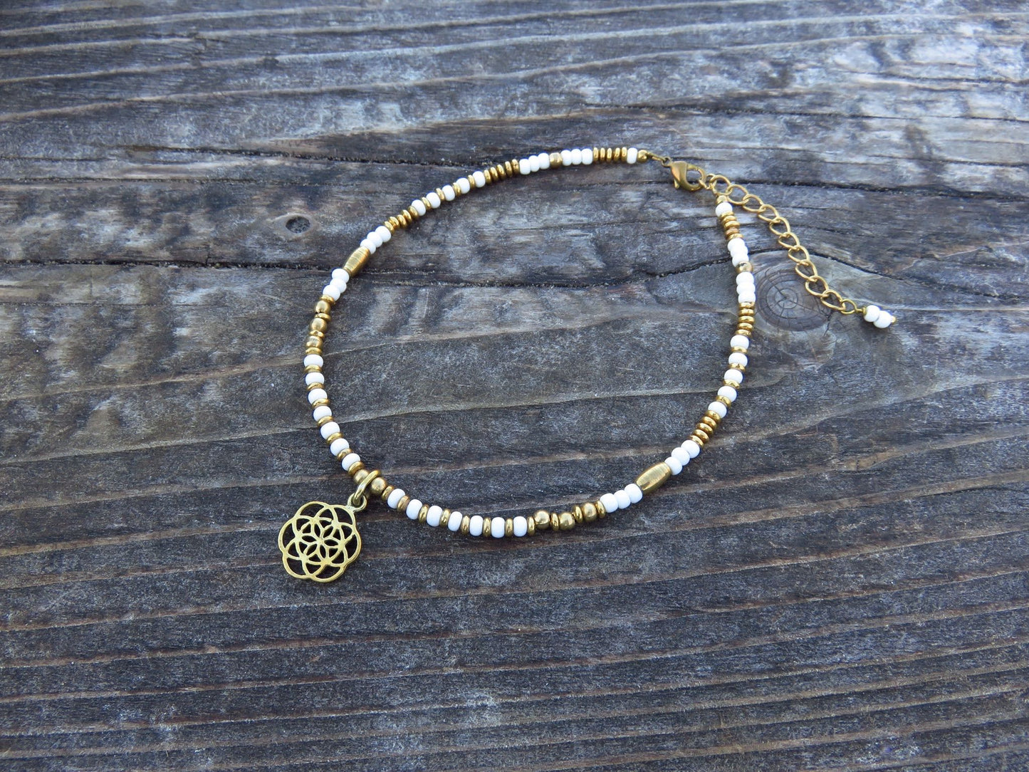 Anklet with brass flower and colored beads