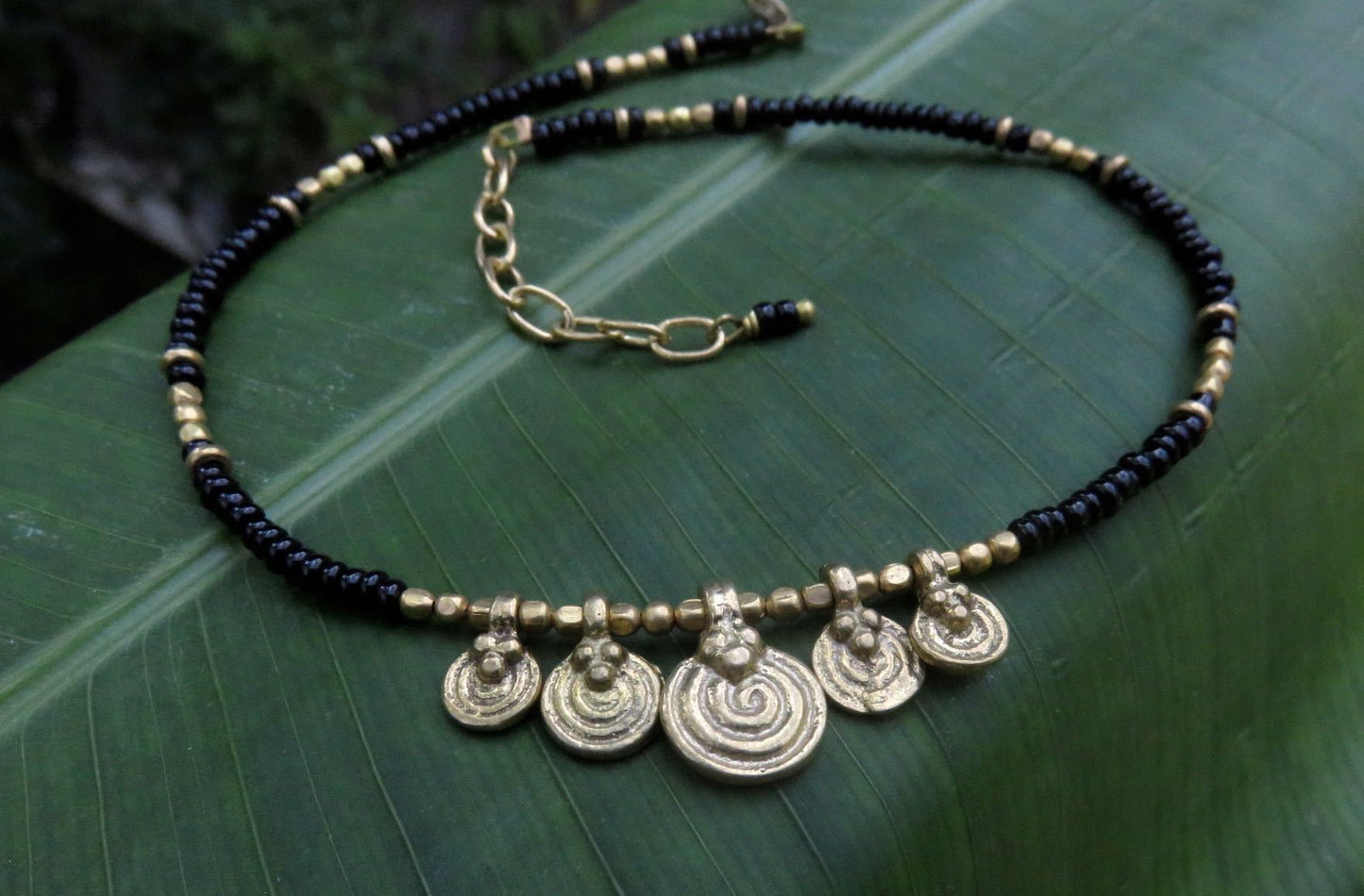 Anklet with small spiral pendants made of brass