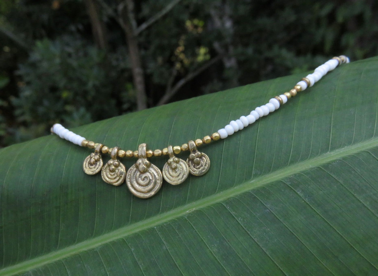 Anklet with small spiral pendants made of brass