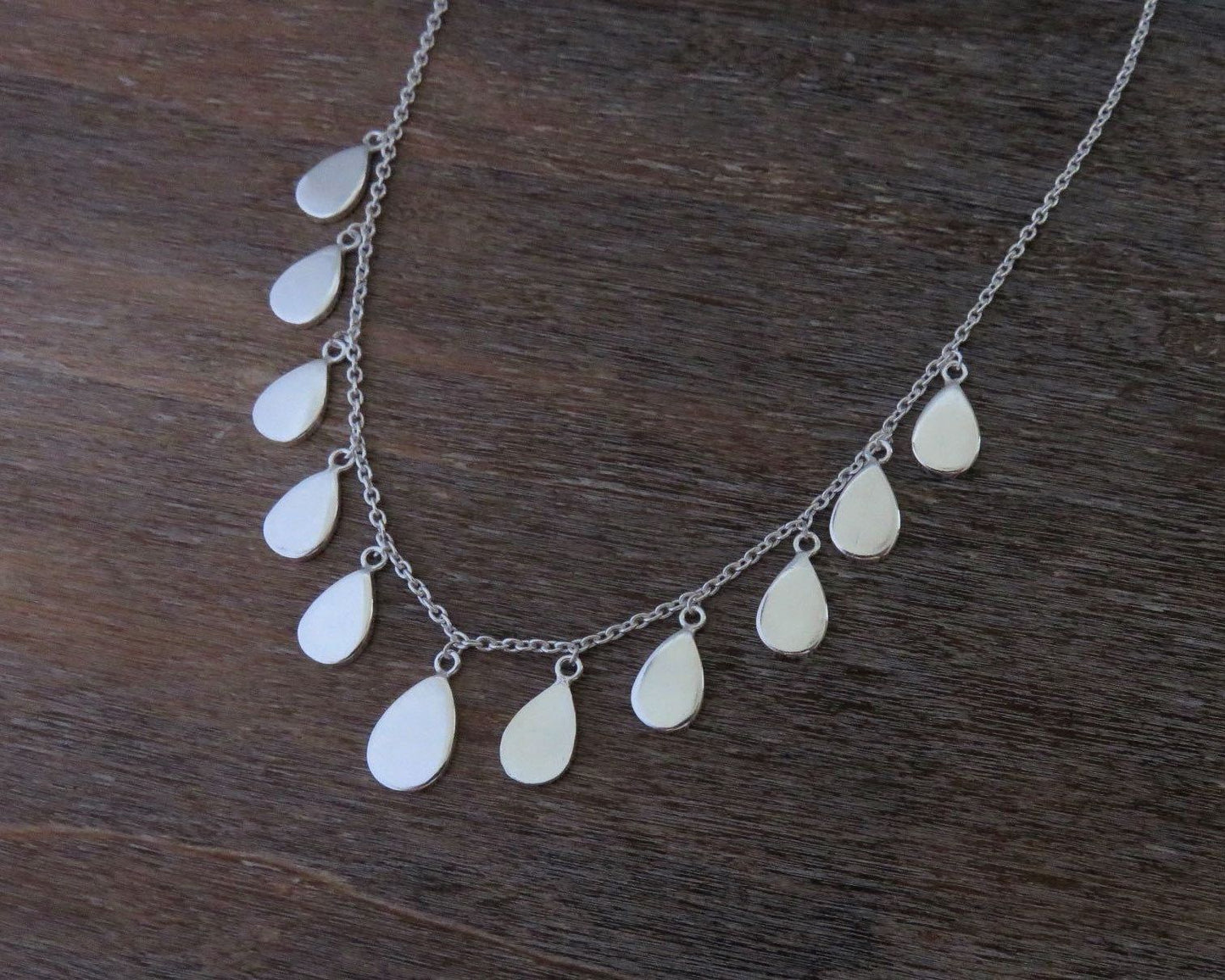 Necklace with small teardrop-shaped pendants made of silver