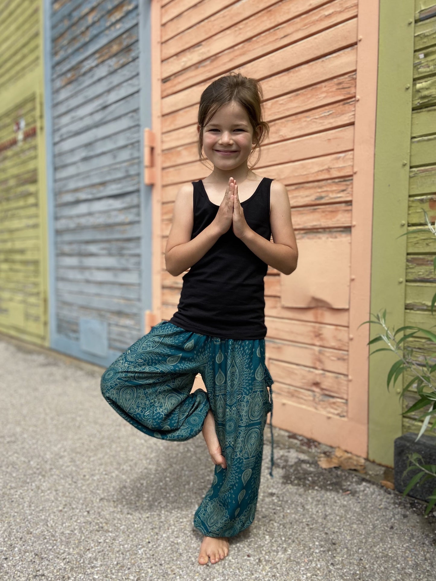 Airy turquoise harem pants with a delicate pattern for children