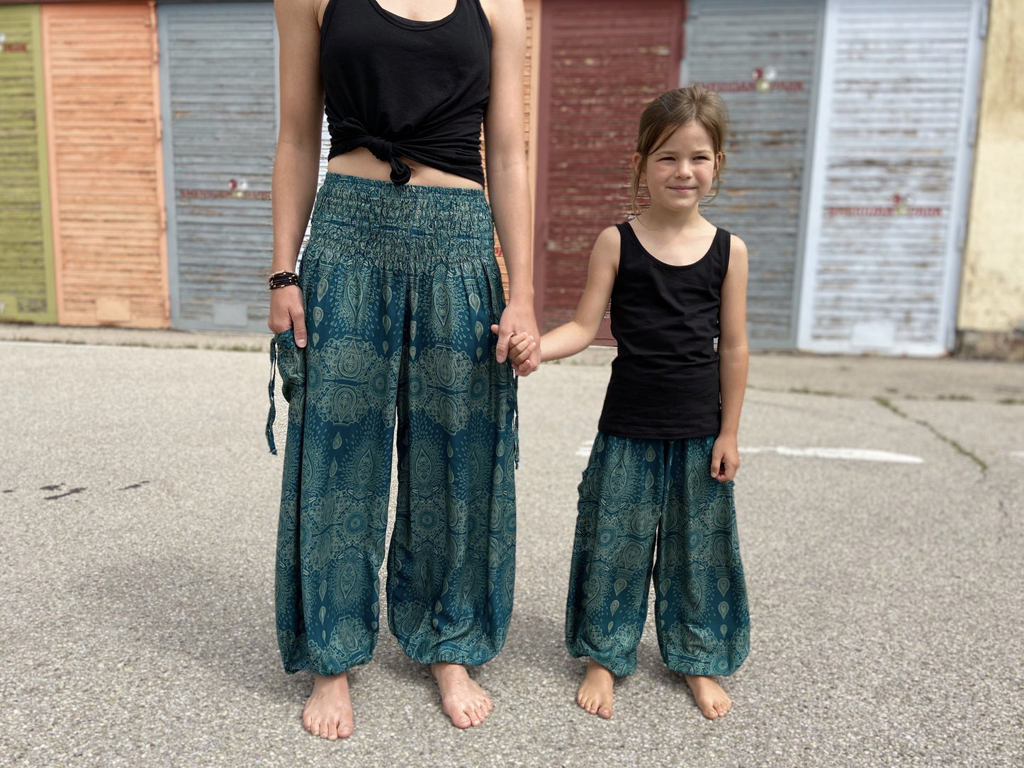 Airy turquoise harem pants with a delicate pattern for children