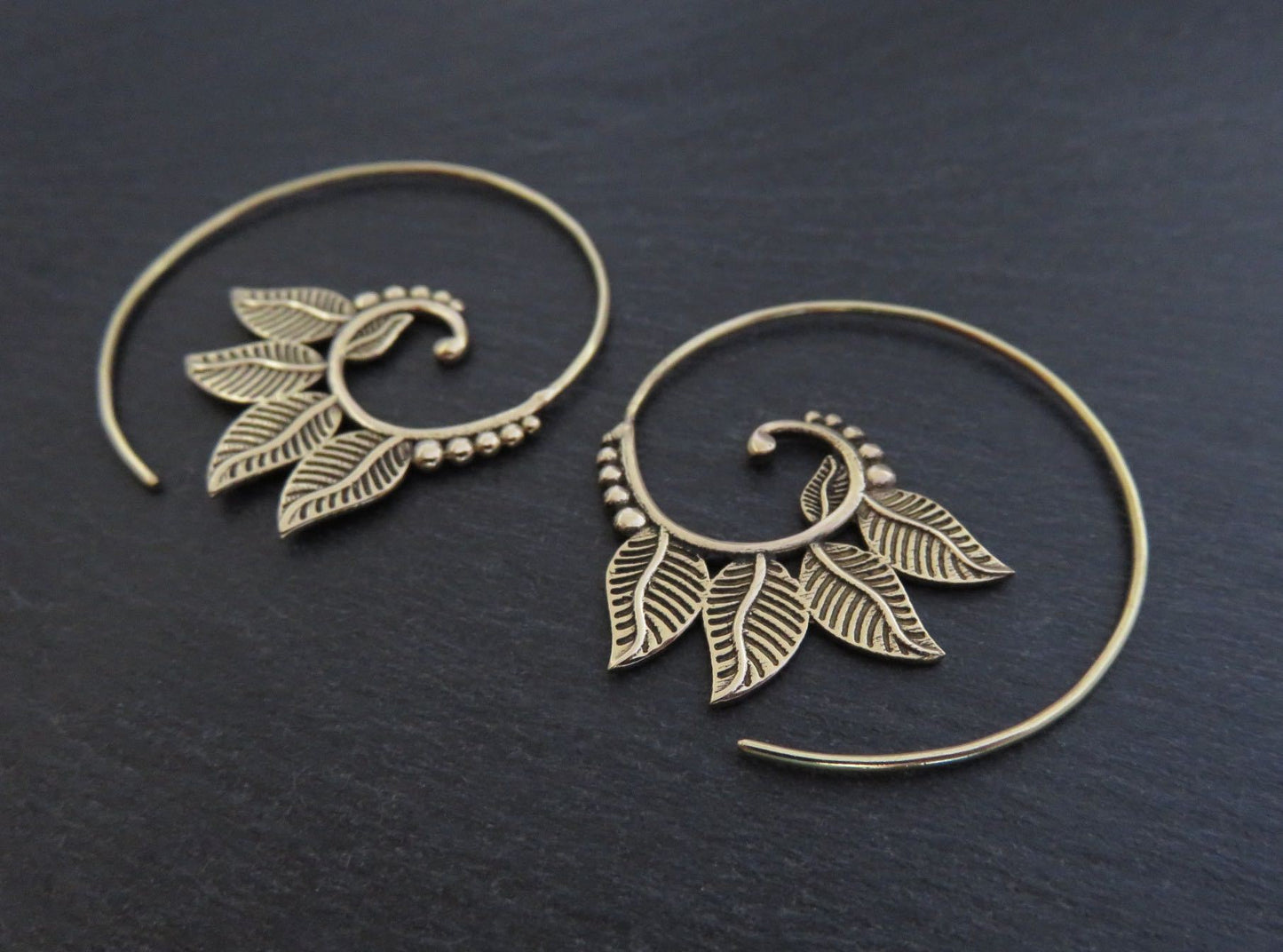 playful spiral earrings with brass leaves