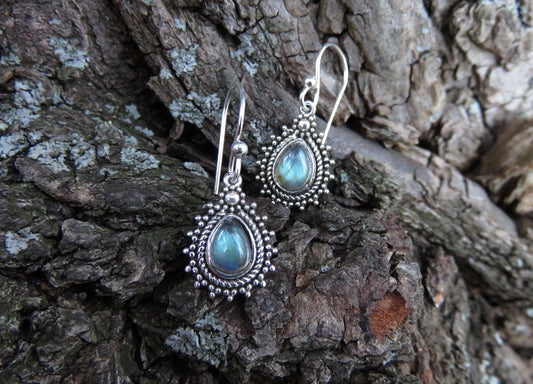 small earrings made of silver with a drop-shaped stone