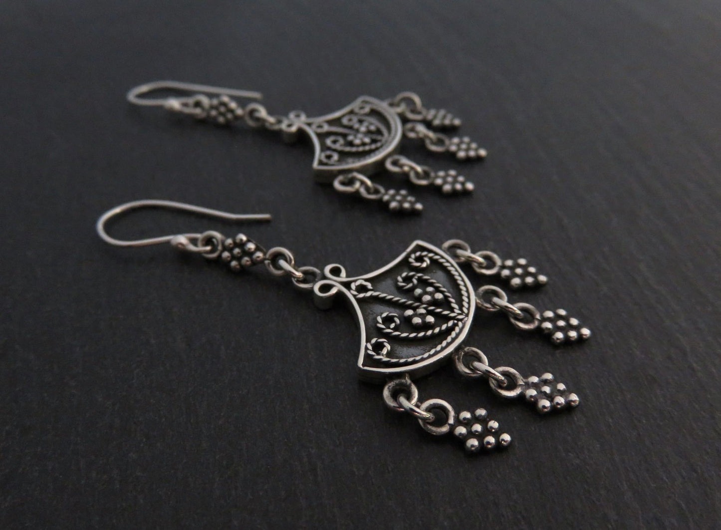 Earrings with dangling silver elements