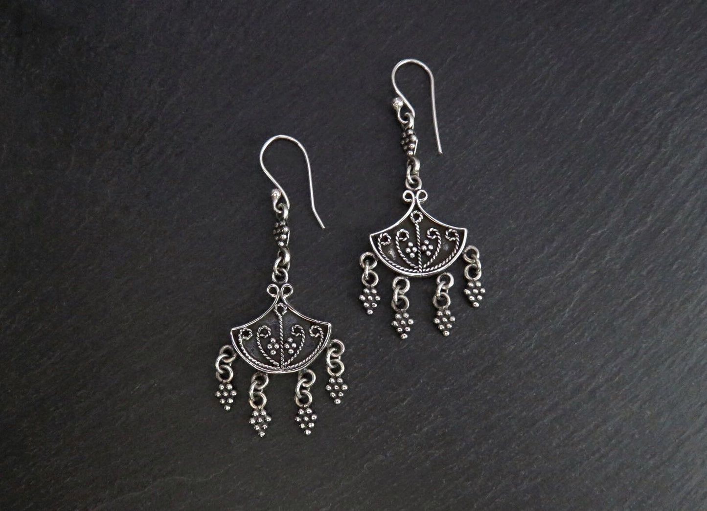 Earrings with dangling silver elements