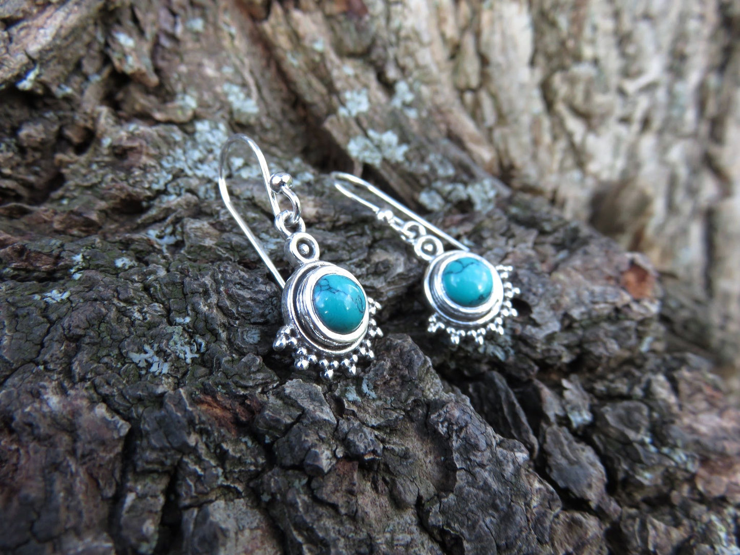 small earrings made of silver with stone and dots