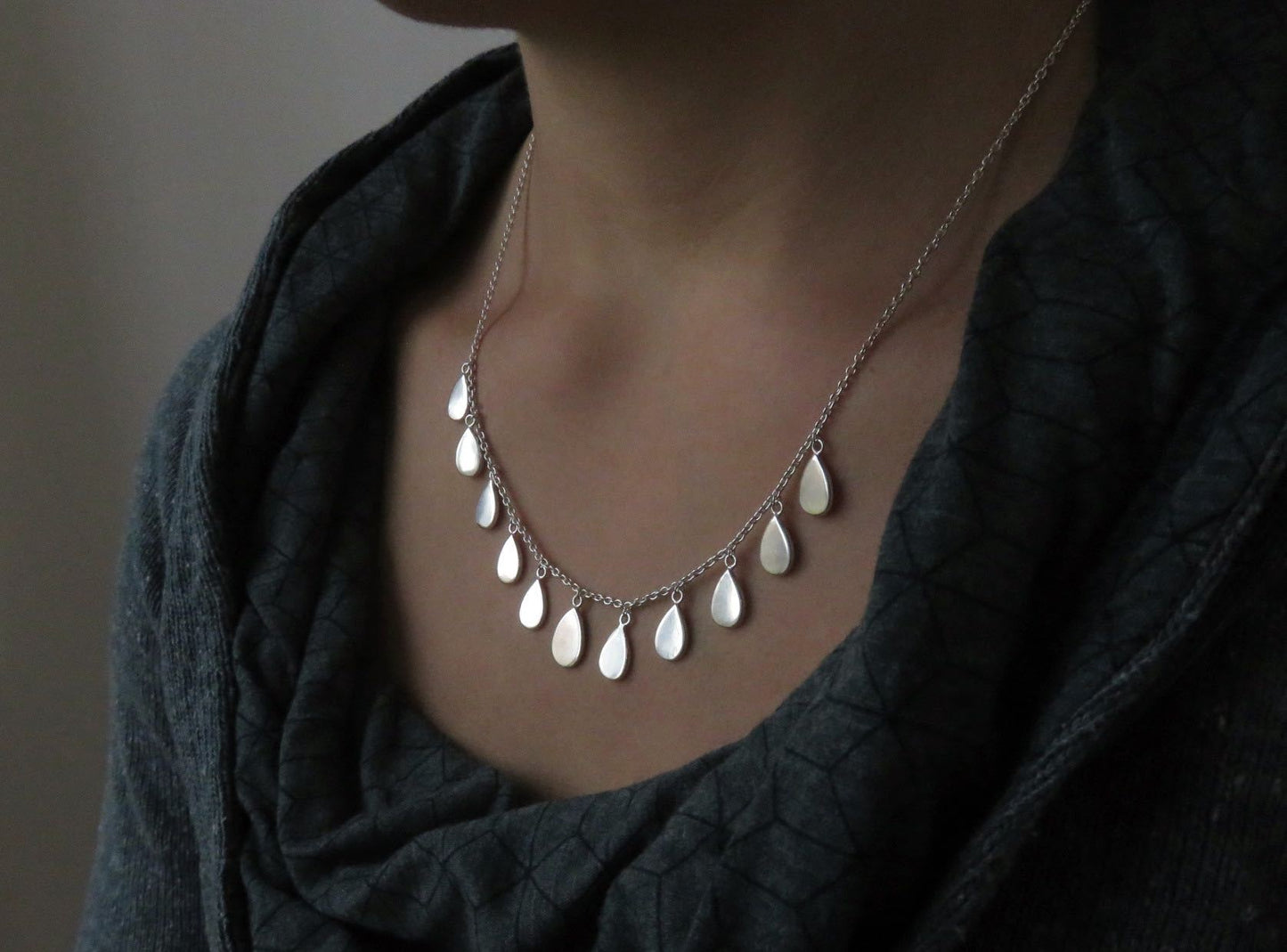 Necklace with small teardrop-shaped pendants made of silver