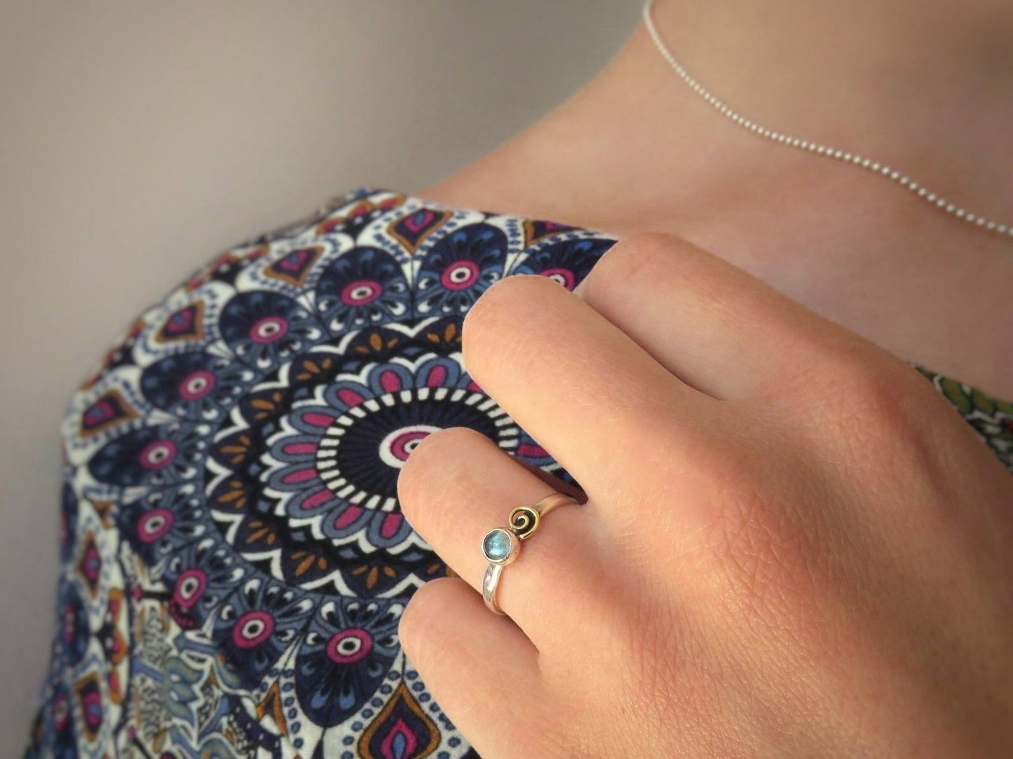 Silver ring with spiral made of brass and labradorite stone