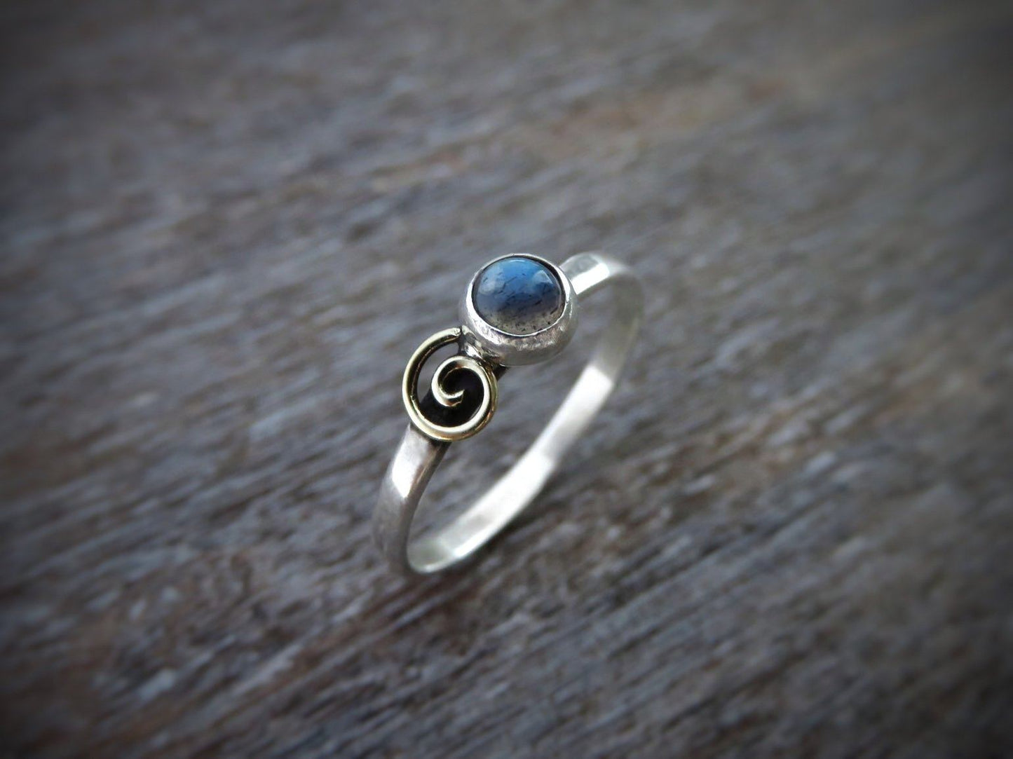 Silver ring with spiral made of brass and labradorite stone