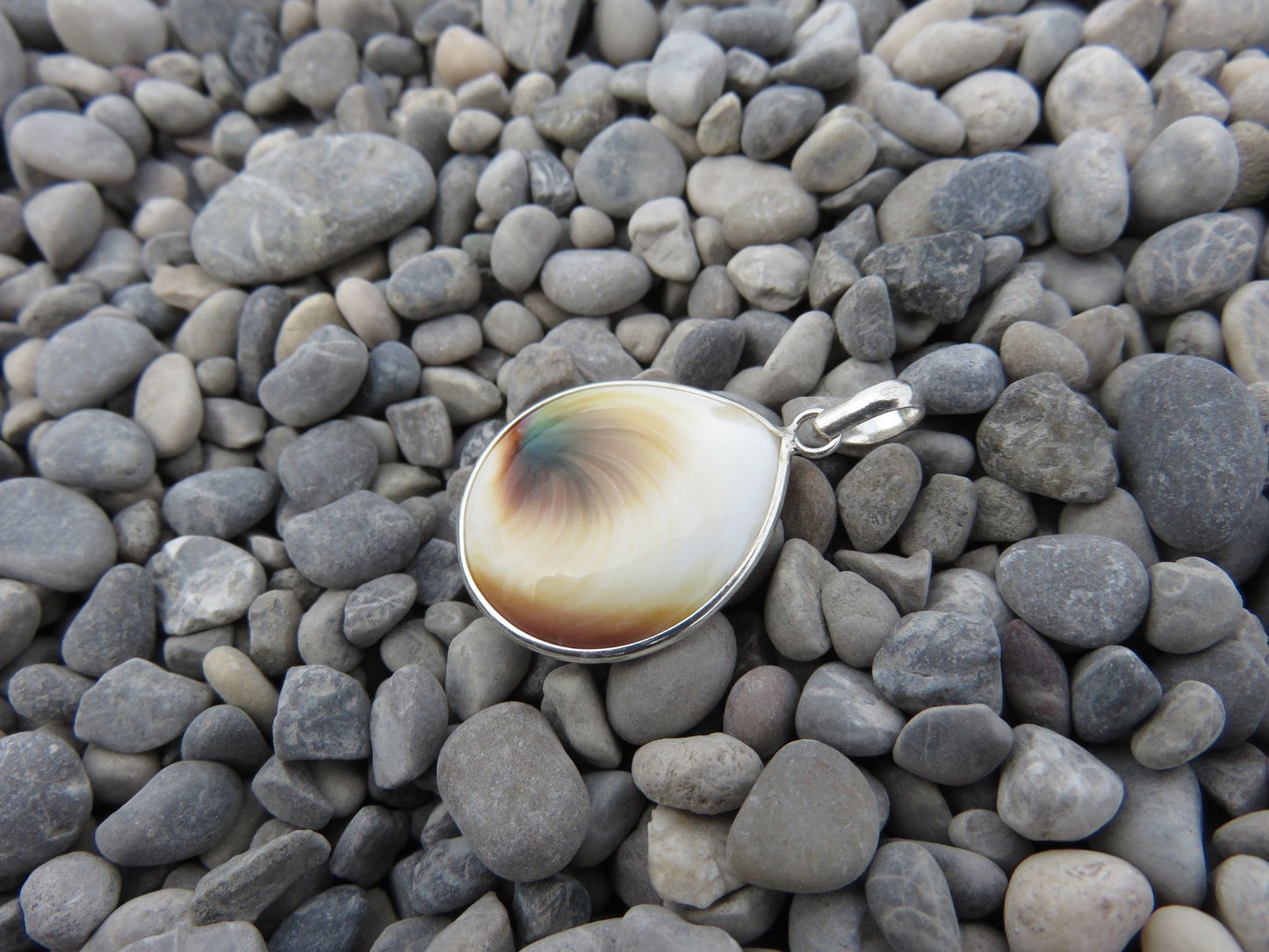 teardrop-shaped operculum pendant made of silver