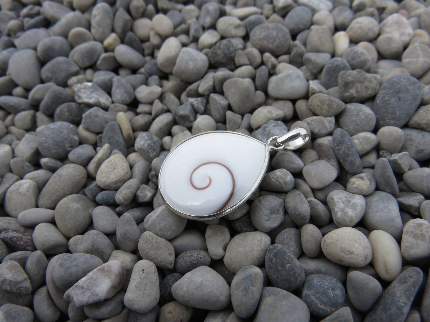 teardrop-shaped operculum pendant made of silver