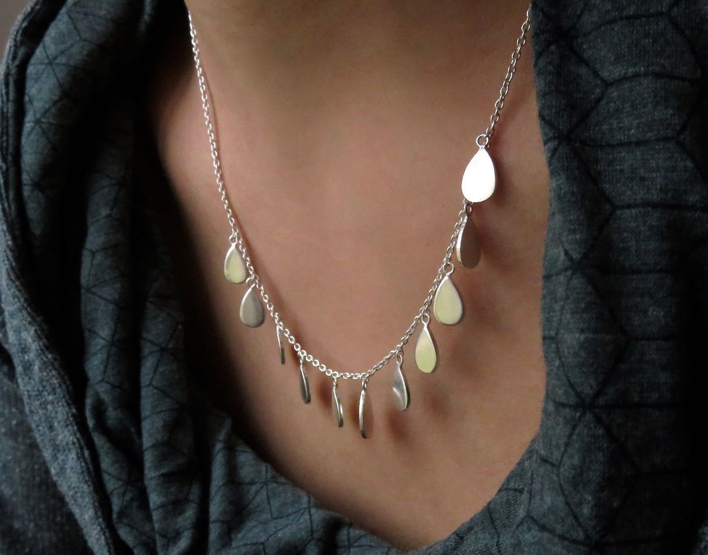 Necklace with small teardrop-shaped pendants made of silver