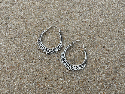 Hoop earrings with spirals and dots made of silver 