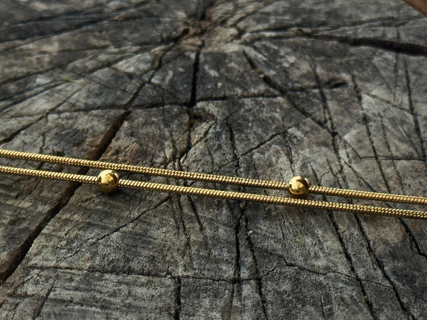 double row anklet made of colored beads and spirals 