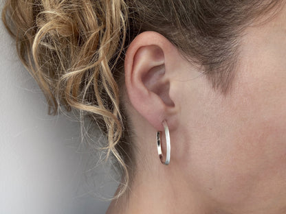 large, oval, simple hoop earrings made of silver, earrings 