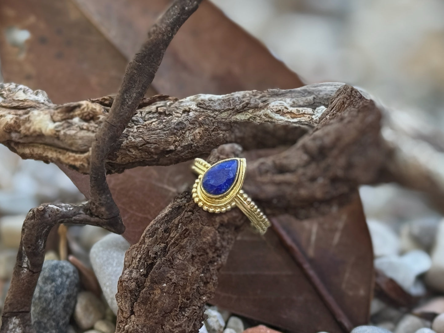 Brass ring with teardrop-shaped turquoise stone 