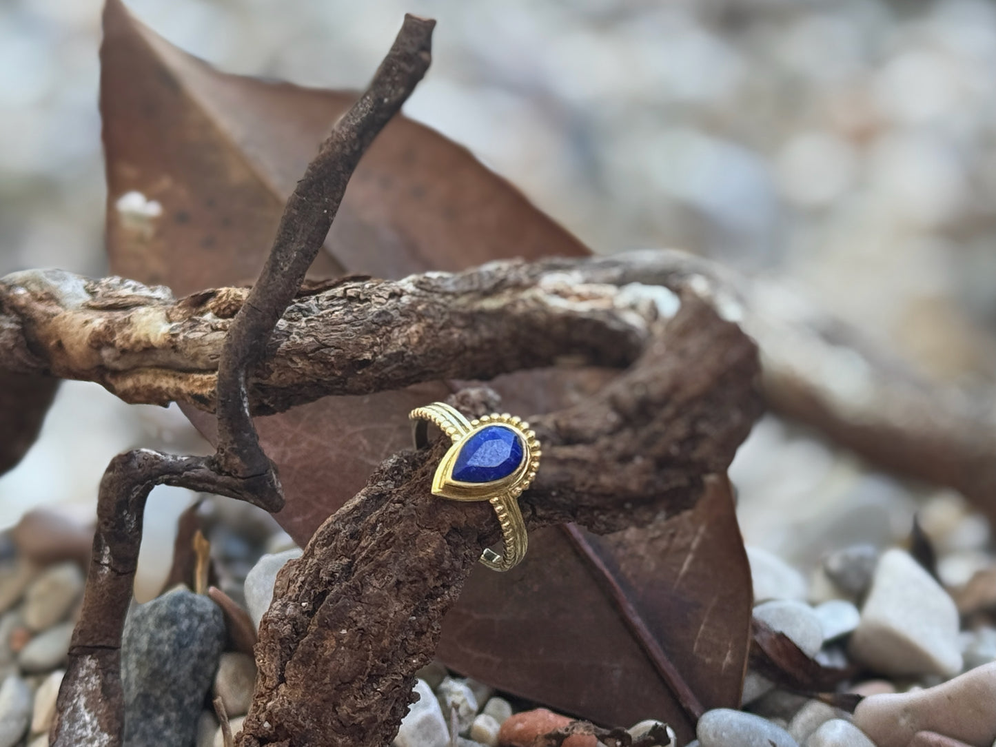 Brass ring with teardrop-shaped turquoise stone 