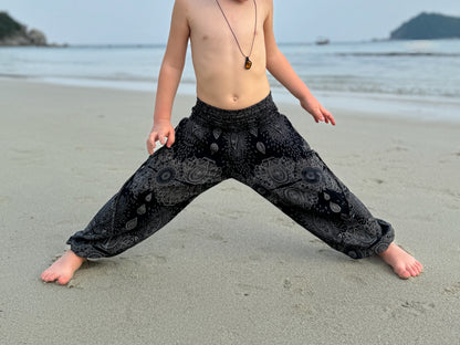 Airy black harem pants with a delicate pattern for children 