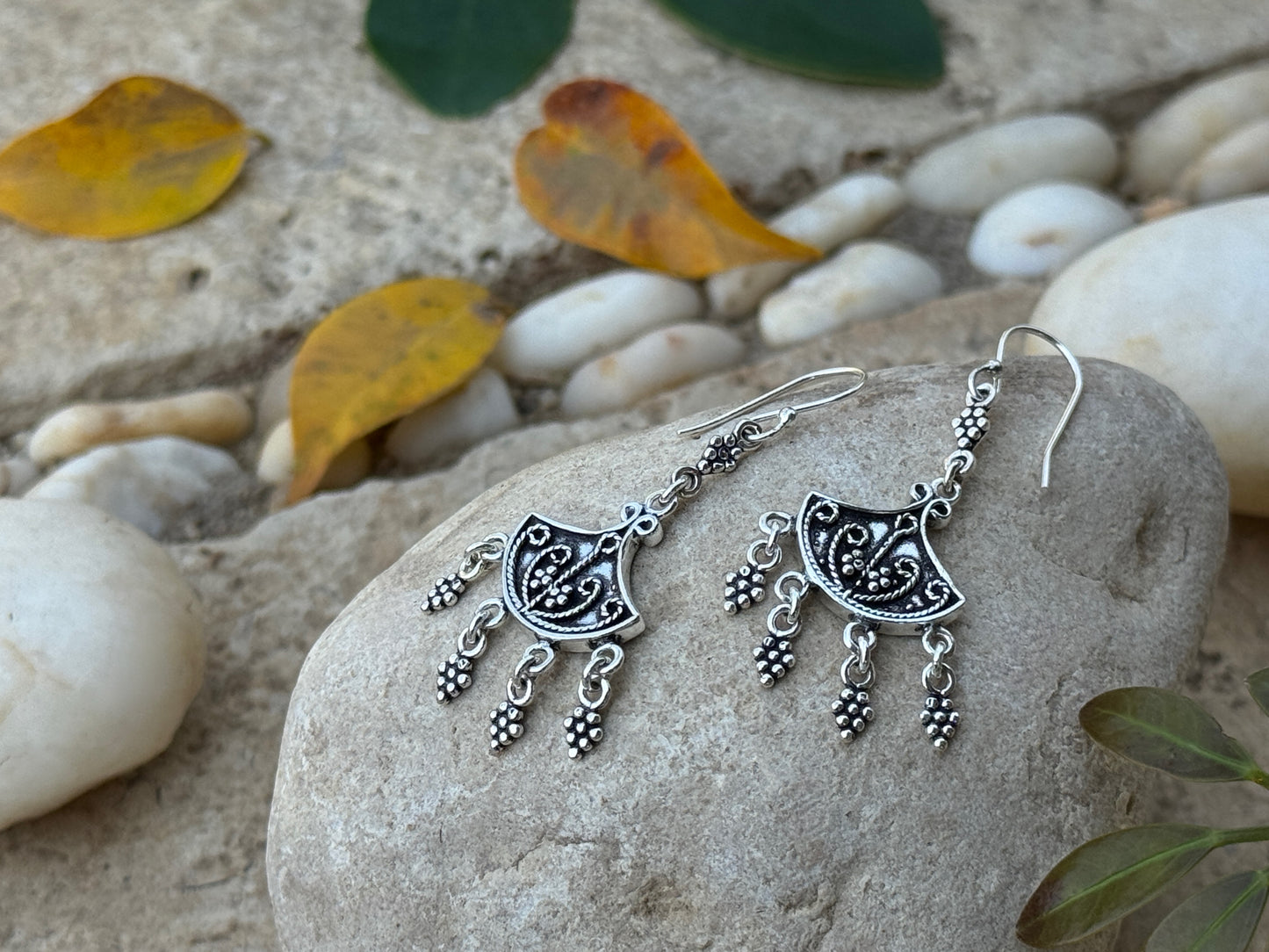 Earrings with dangling silver elements 