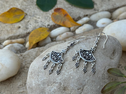 Earrings with dangling silver elements 