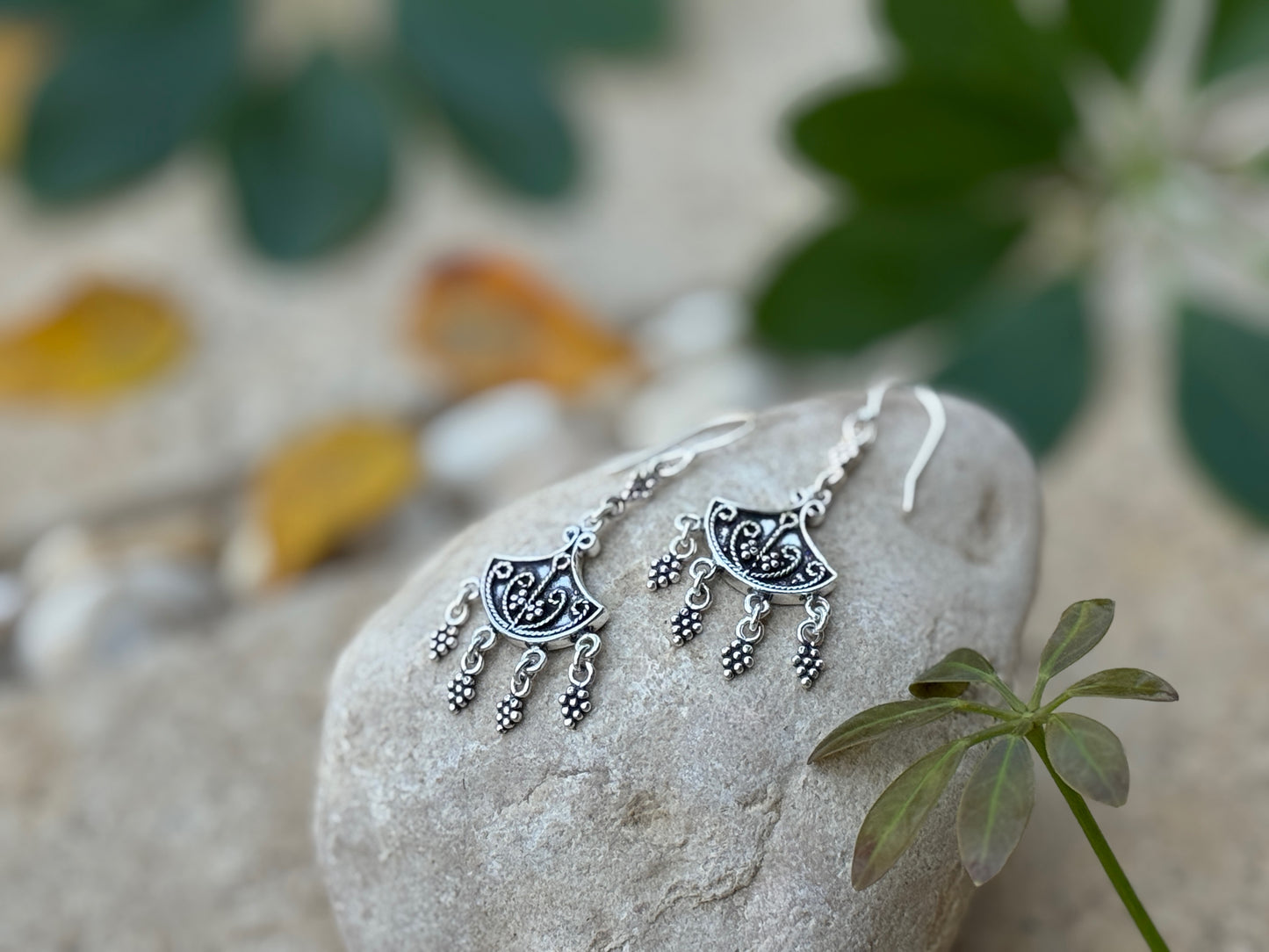 Earrings with dangling silver elements 