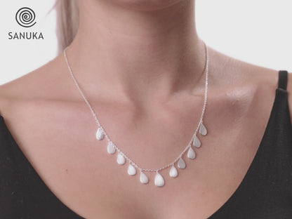 Necklace with small teardrop-shaped pendants made of silver 
