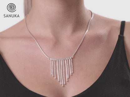Necklace with small dangling silver chains 