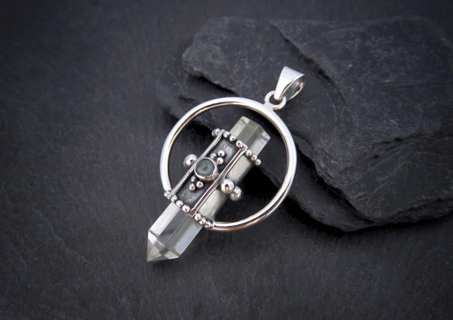 Rock crystal pendant with small stone made of silver 