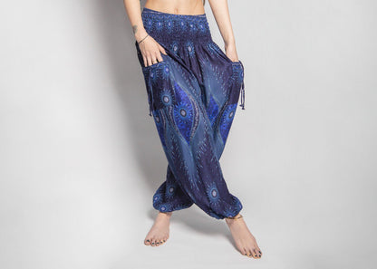 Airy harem pants with a peacock pattern in dark blue