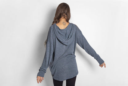 long, plain knitted sweater with a large hood and thumbholes in blue 