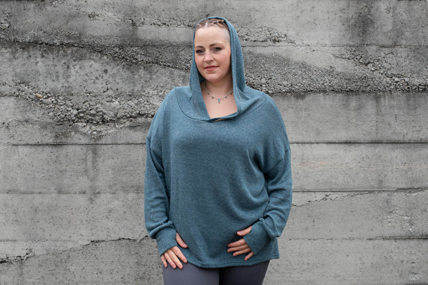 PLUS SIZE, long, plain knitted sweater with a large hood and thumbholes in blue 