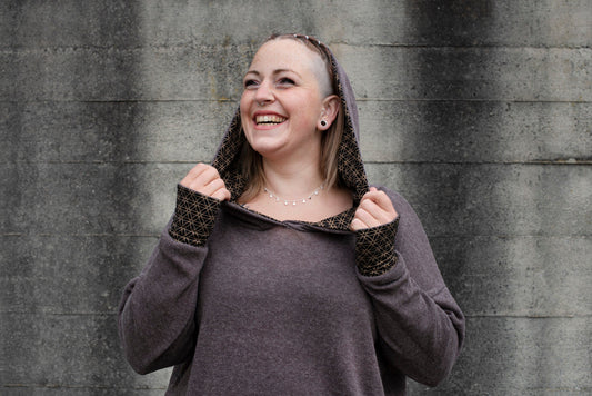 PLUS SIZE, long knitted sweater with a patterned hood and thumbholes in brown 