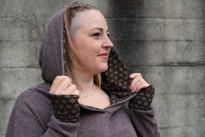 PLUS SIZE, long knitted sweater with a patterned hood and thumbholes in brown 