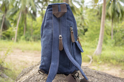 practical canvas shoulder bag with straps in blue 