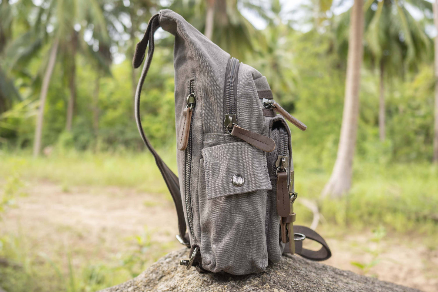 practical canvas shoulder bag with straps in gray 