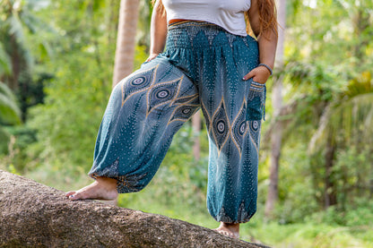 PLUS SIZE harem pants with a peacock pattern in turquoise